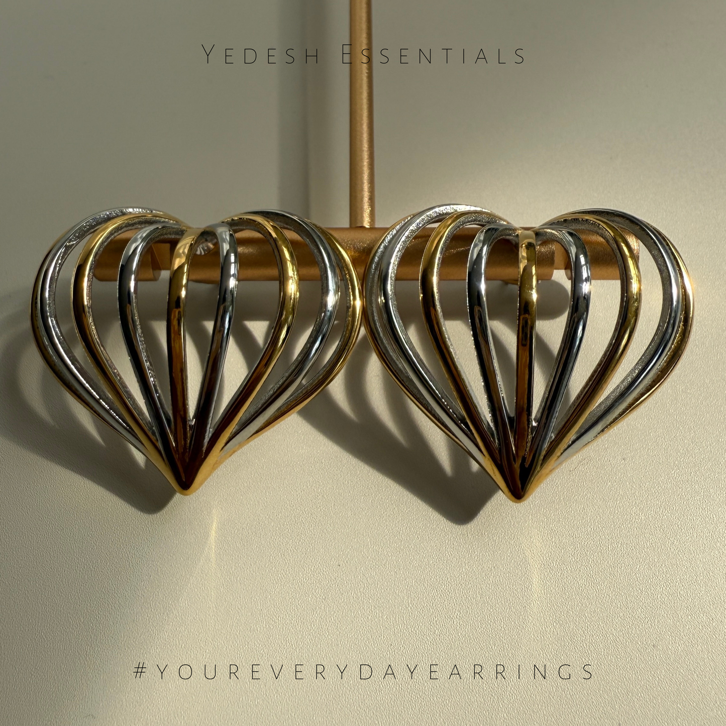 Mixed metal heart shaped earrings