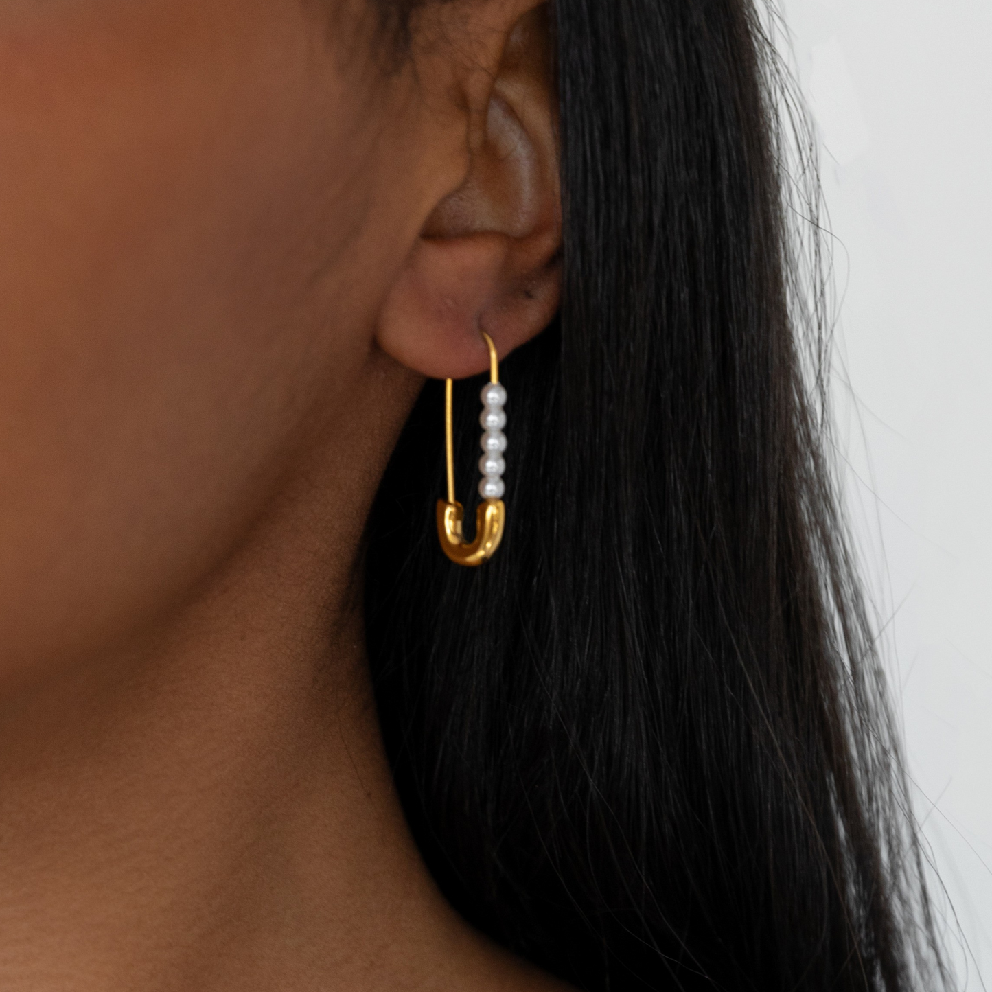 Delicate pearl safety pin earring